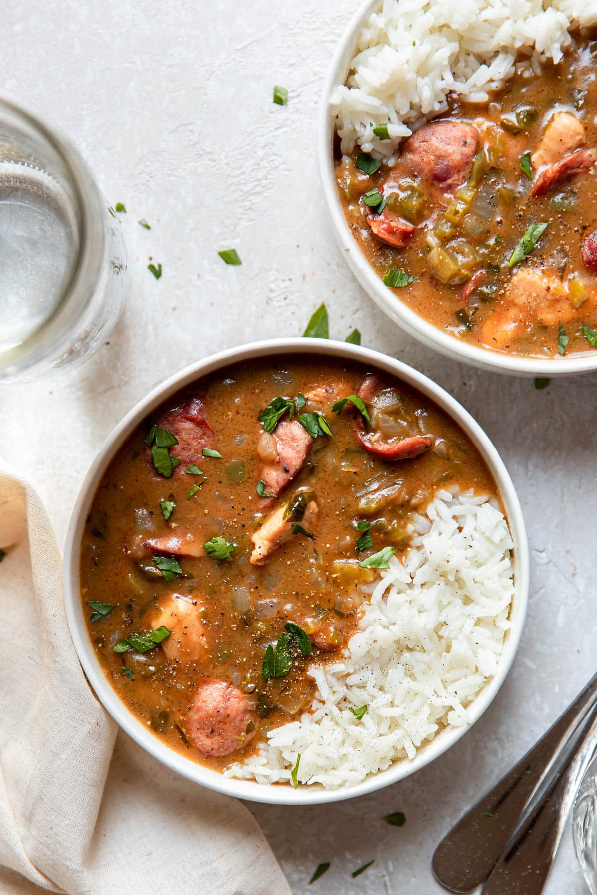 chicken and sausage gumbo in a bowl with rice