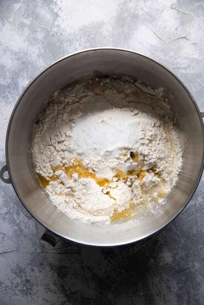 homemade pizza dough in a mixing bowl