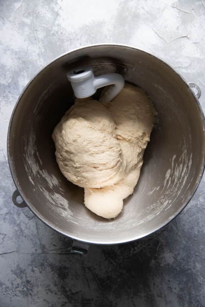 homemade pizza dough in a mixing bowl