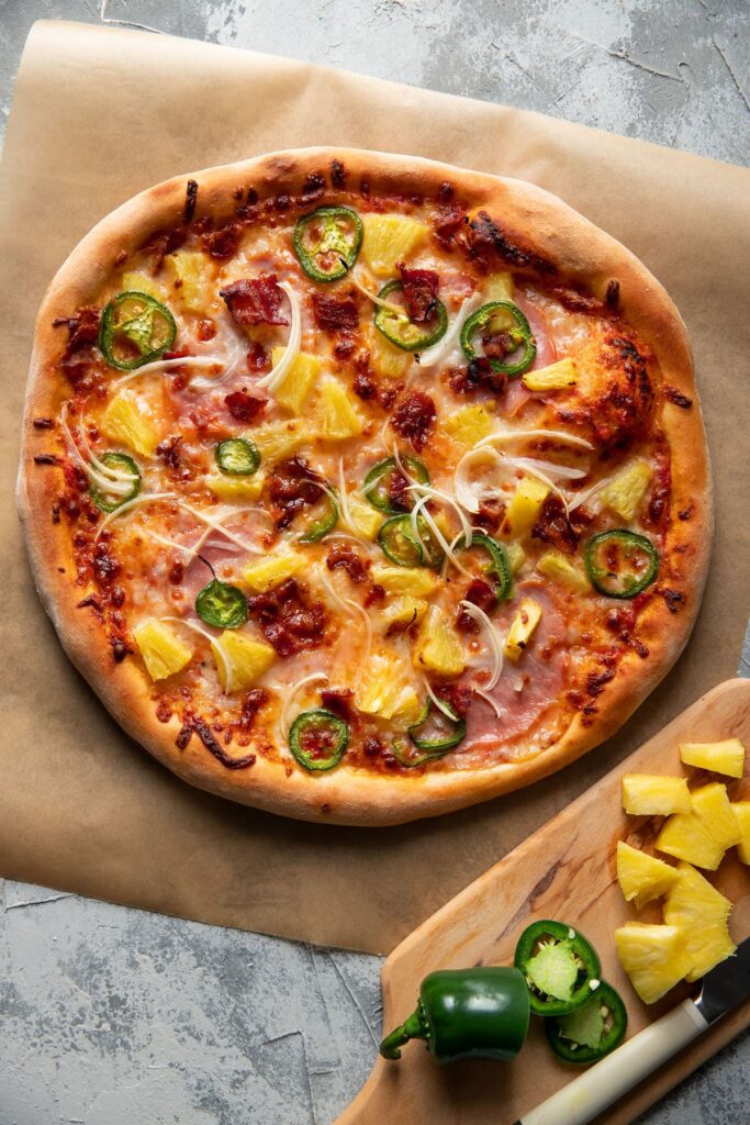 mellow mushroom style pizza with pineapple jalapeno and bacon on top