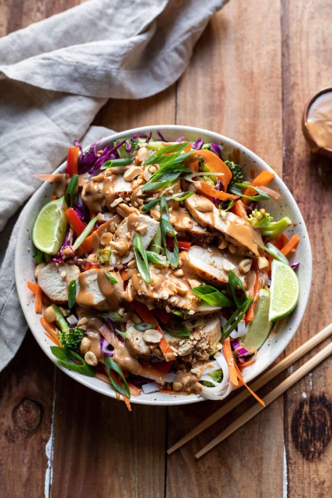 asian chicken salad with rice noodles and vegetables