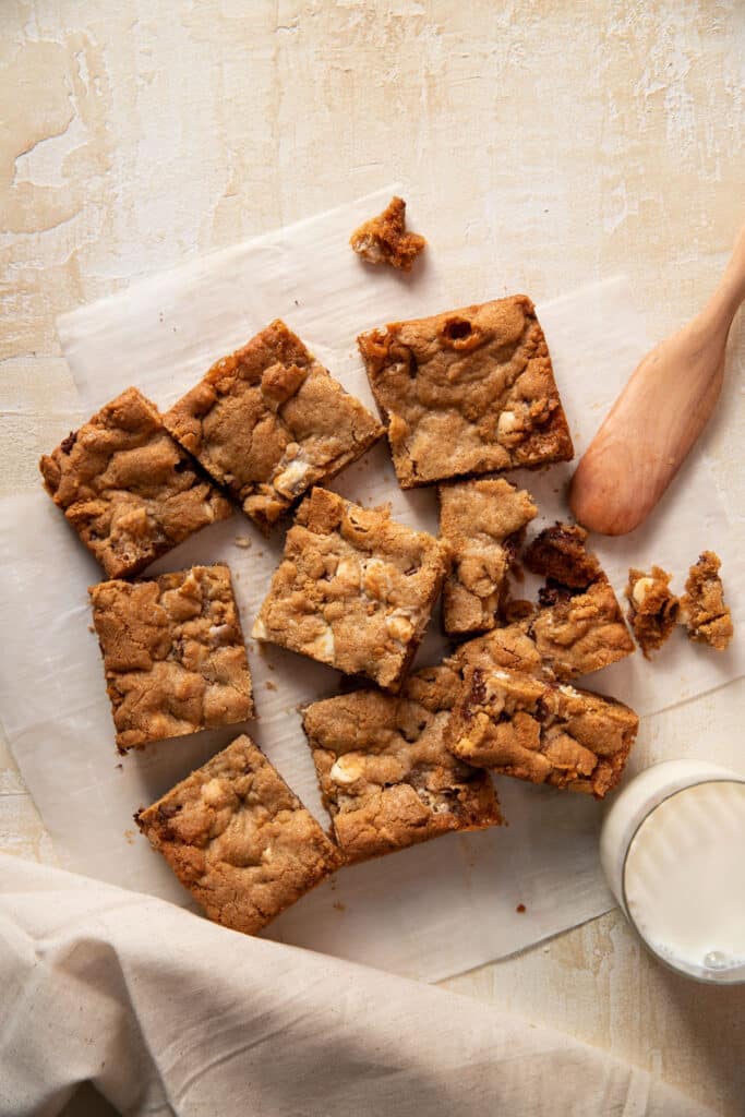 s'mores cookie bars on a piece of parchment paper cut into squares