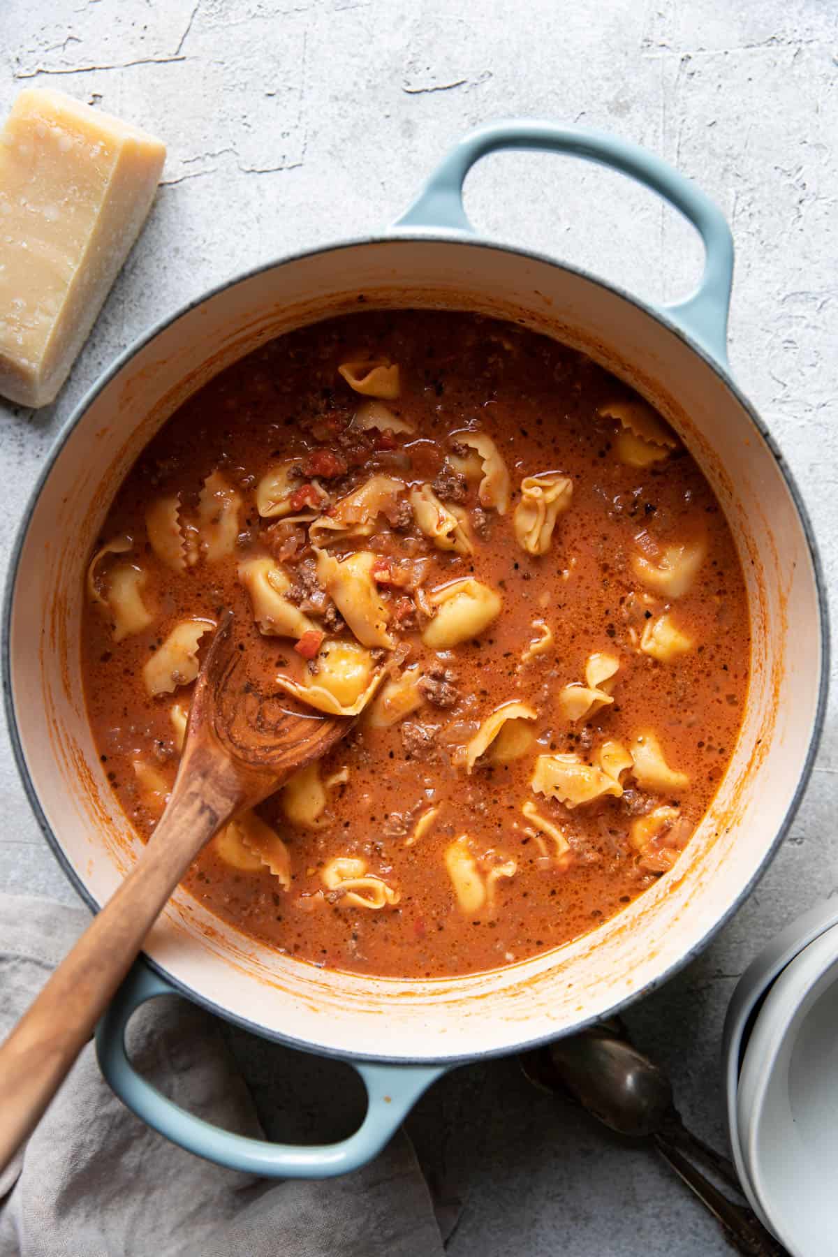 tortellini soup in a soup pot.