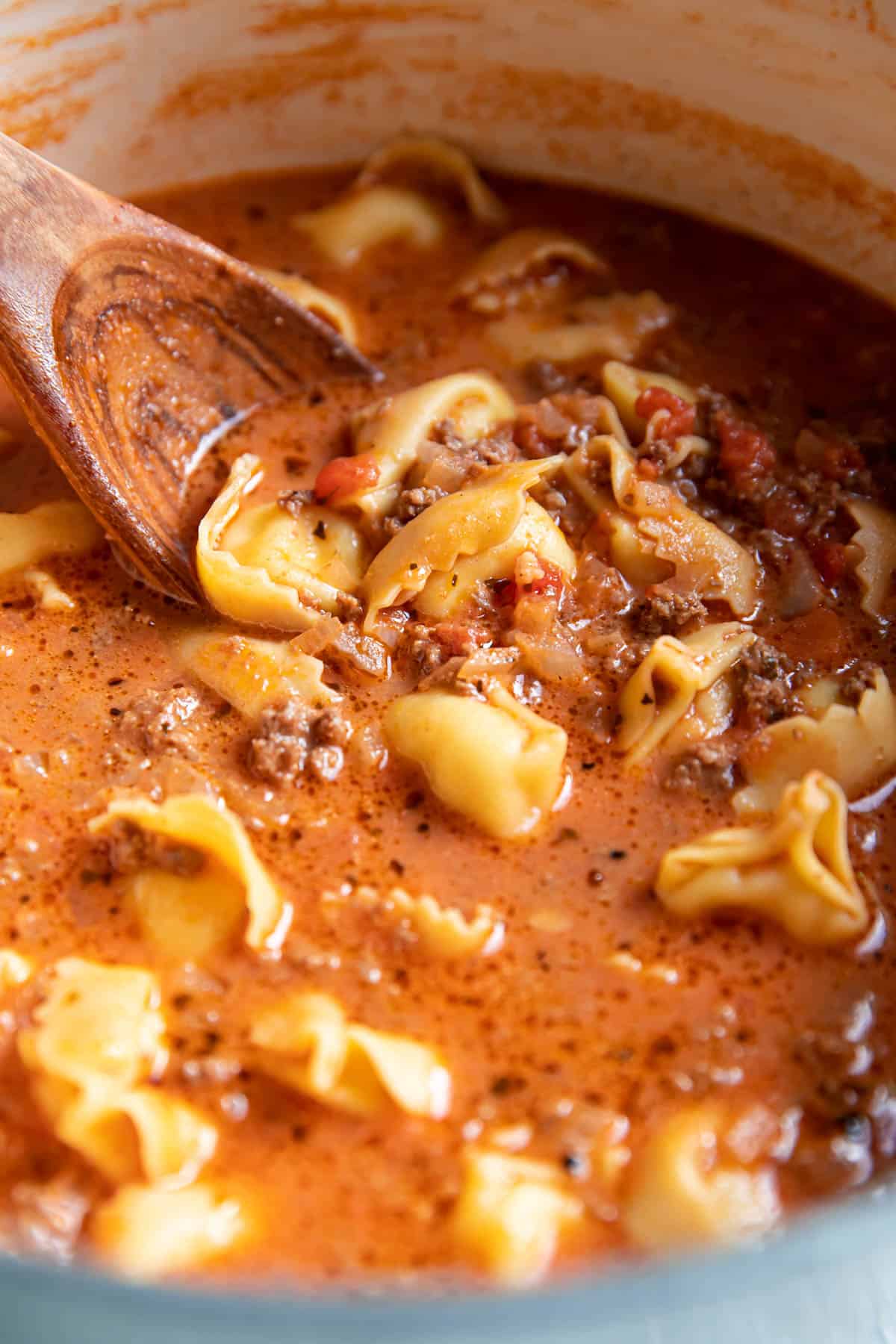 tortellini soup in a soup pot.