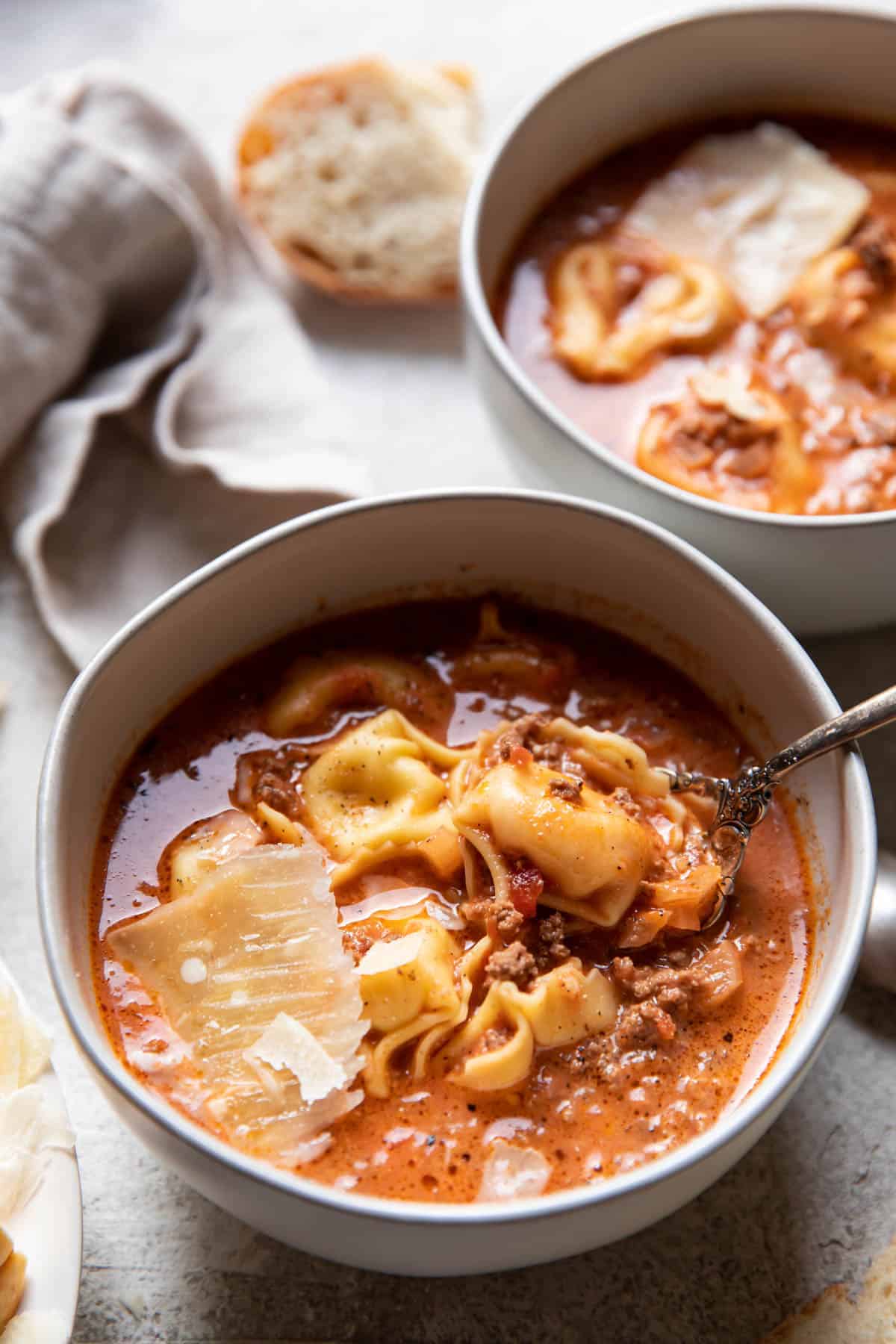 Creamy lasagna tortellini soup in bowls.