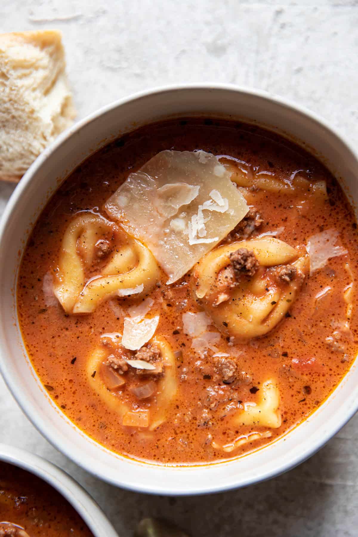 Creamy lasagna tortellini soup in bowls.