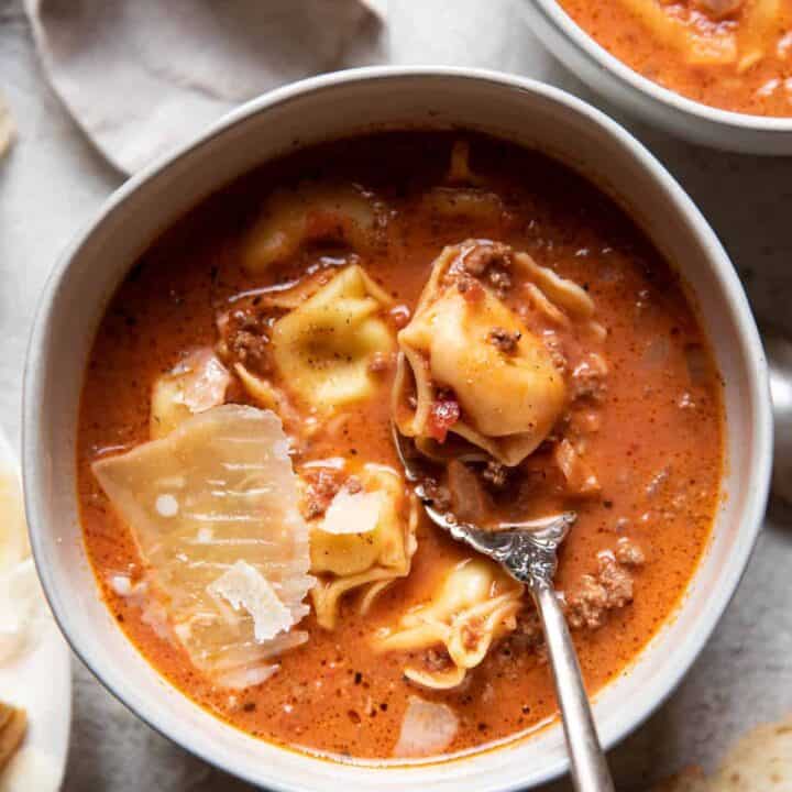 Creamy lasagna tortellini soup in bowls.