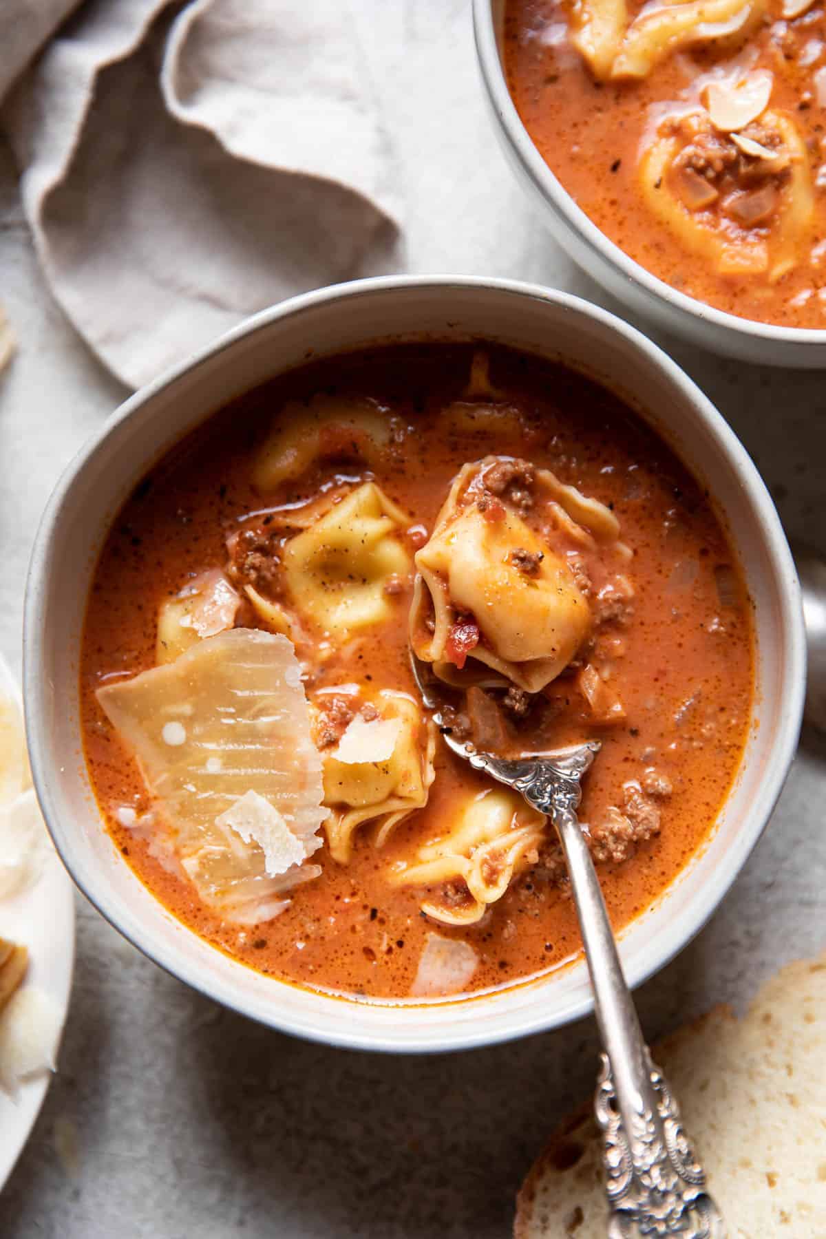 Creamy lasagna tortellini soup in bowls.