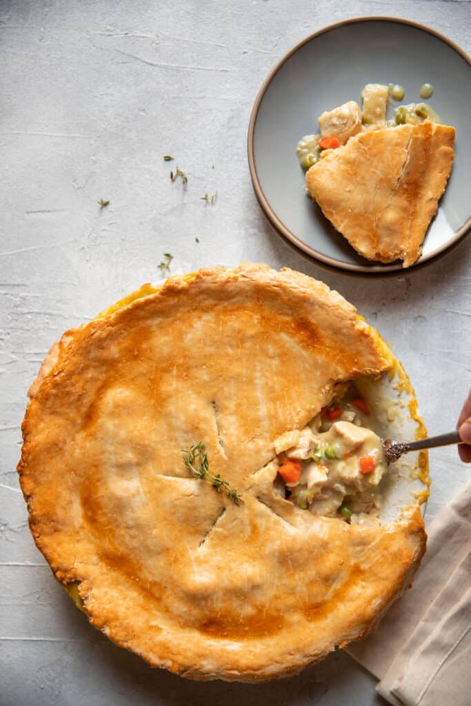chicken pot pie being scooped with a spoon
