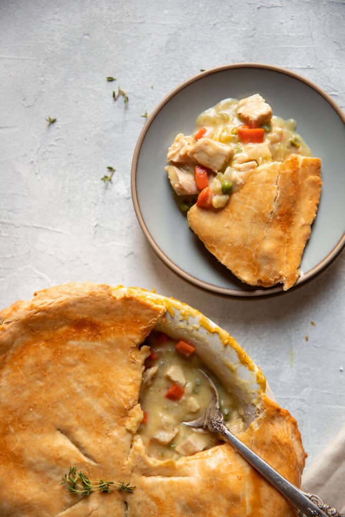 chicken pot pie in the dish and on a plate