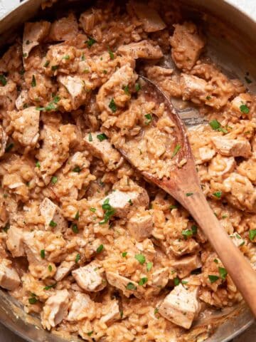 chicken and risotto in a saute pan