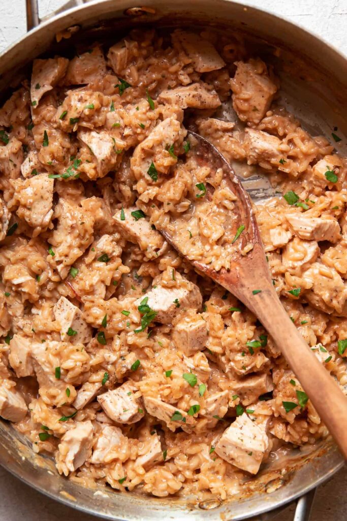 chicken and risotto in a saute pan