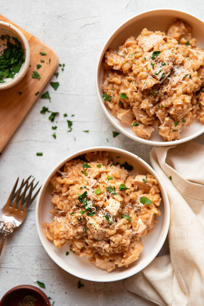 plates of buttermilk chicken and risotto