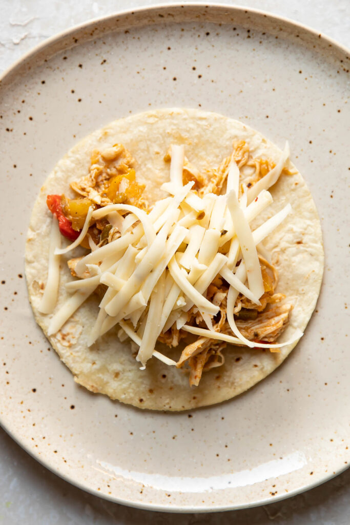 Enchilada being assembled.