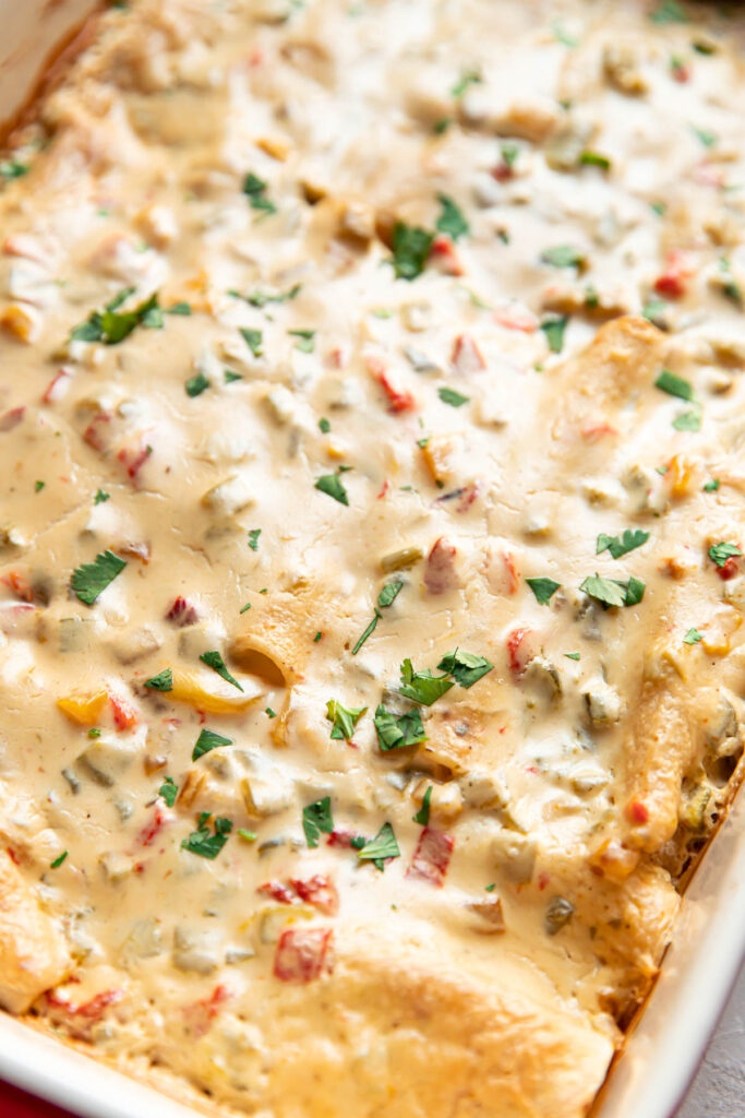 Enchiladas in a baking dish after being baked.