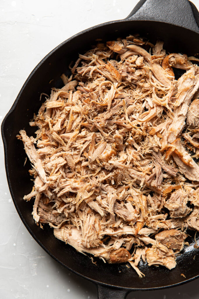 carnitas in a skillet.