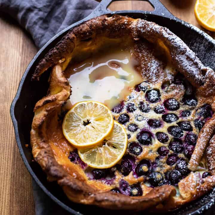 puffy blueberry dutch baby pancake with lemon curd