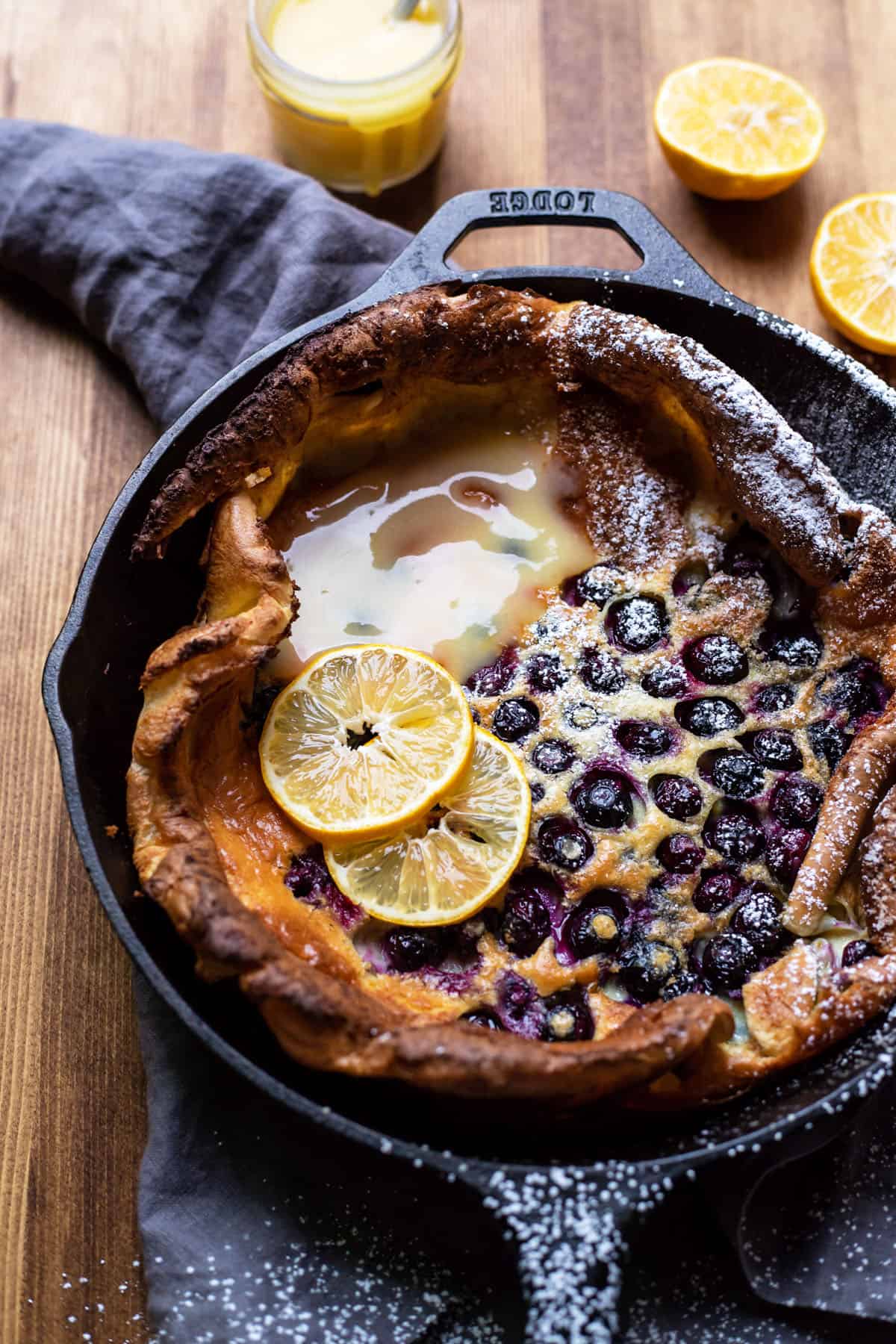 puffy blueberry dutch baby pancake with lemon curd