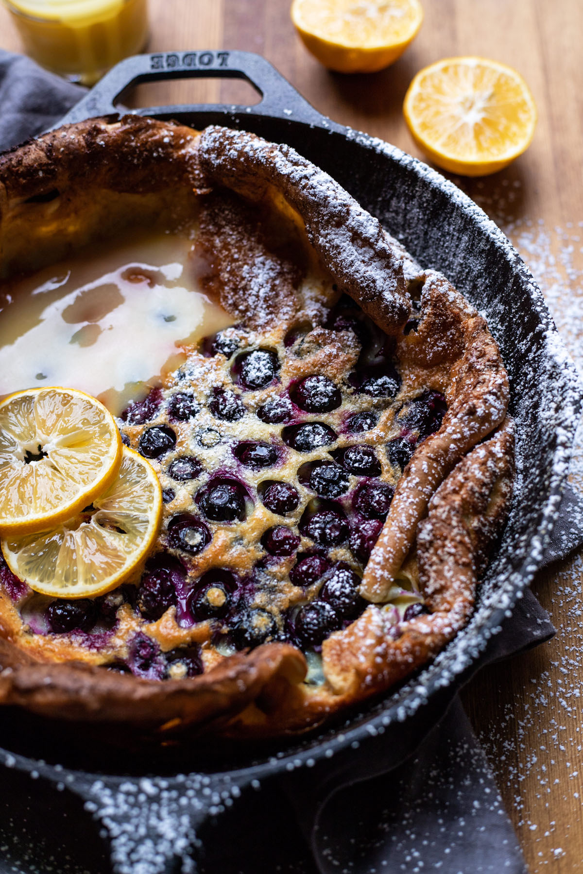 puffy blueberry dutch baby pancake with lemon curd