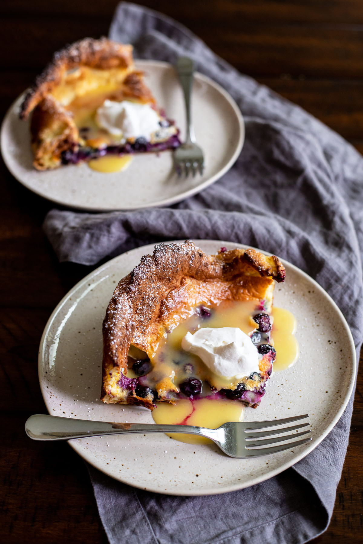 puffy blueberry dutch baby pancake with lemon curd