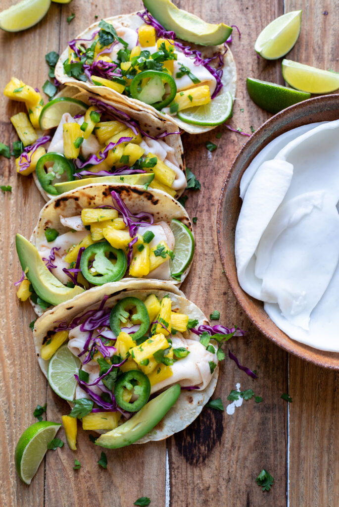 street tacos filled with chili lime coconut meat avocado and pineapple