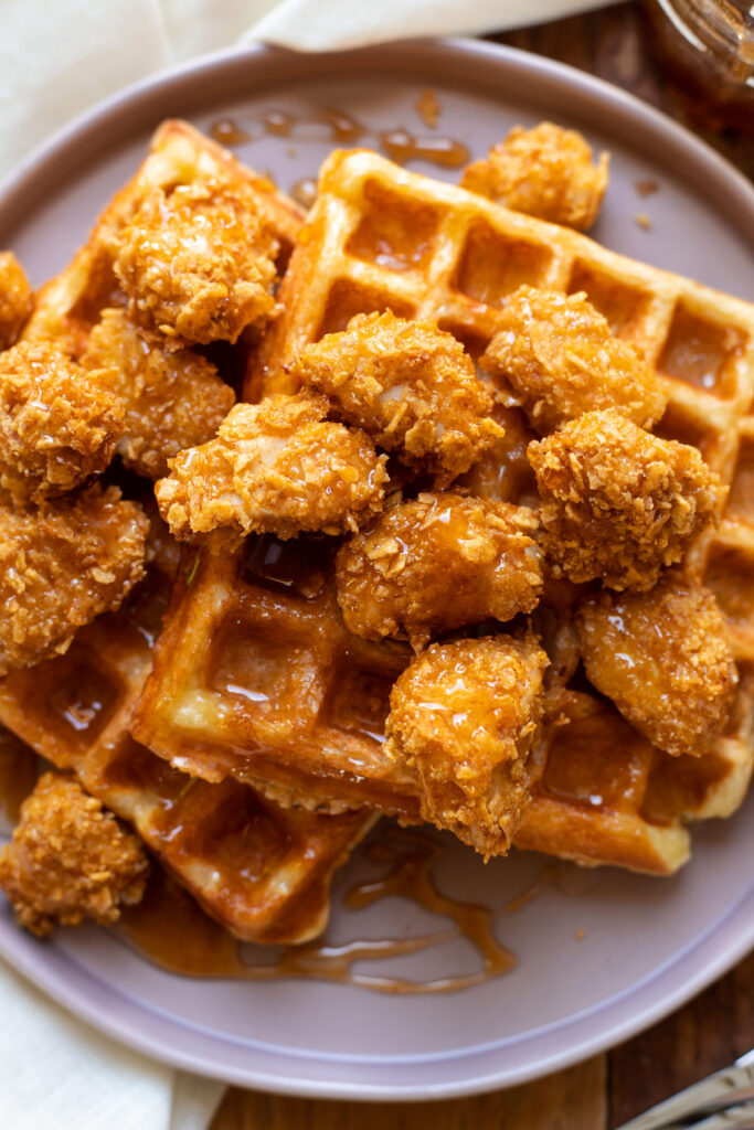 crispy baked chicken nuggets and buttermilk waffles with sriracha honey