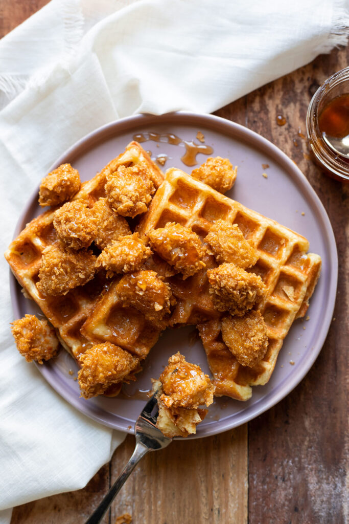 crispy baked chicken nuggets and buttermilk waffles with sriracha honey