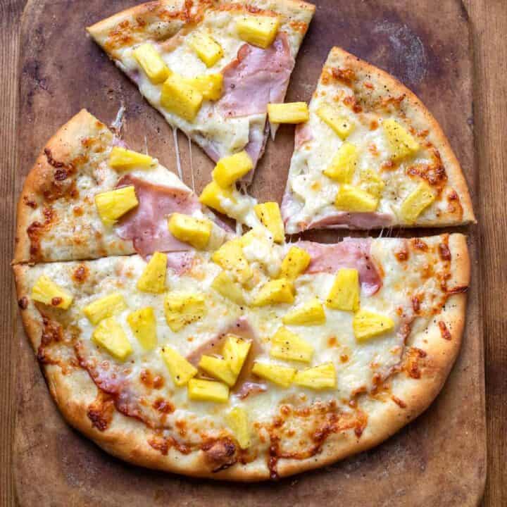 pizza with olive oil mozzarella cheese ham and pineapple