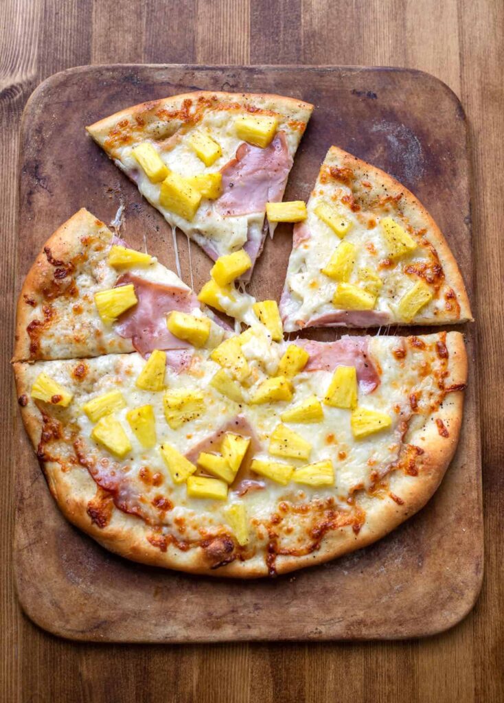 pizza with olive oil mozzarella cheese ham and pineapple