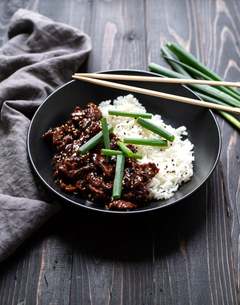 mongolian beef with white rice and green onions