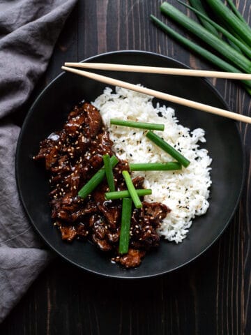 mongolian beef with white rice and green onions