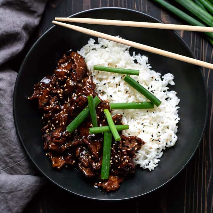 mongolian beef with white rice and green onions