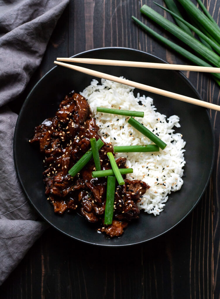 mongolian beef with white rice and green onions