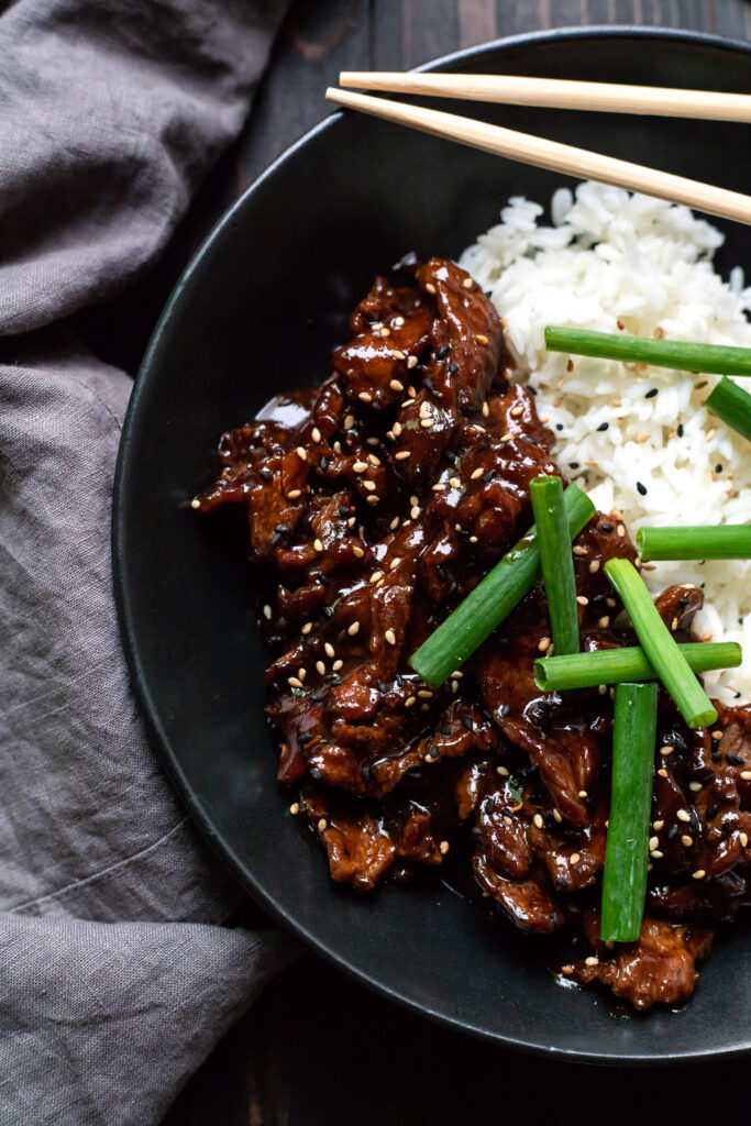 mongolian beef with white rice and green onions