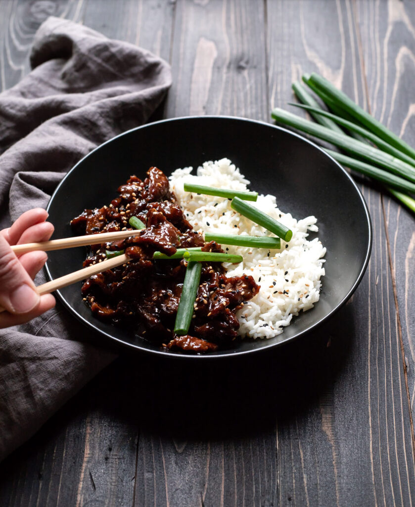 mongolian beef with white rice and green onions