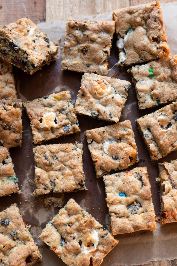 Scrumptious cookie bars filled with marshmallows, oreos and mms