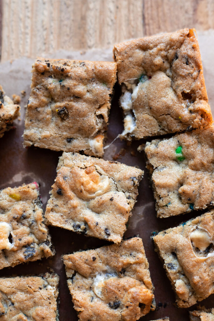 Scrumptious cookie bars filled with marshmallows, oreos and mms