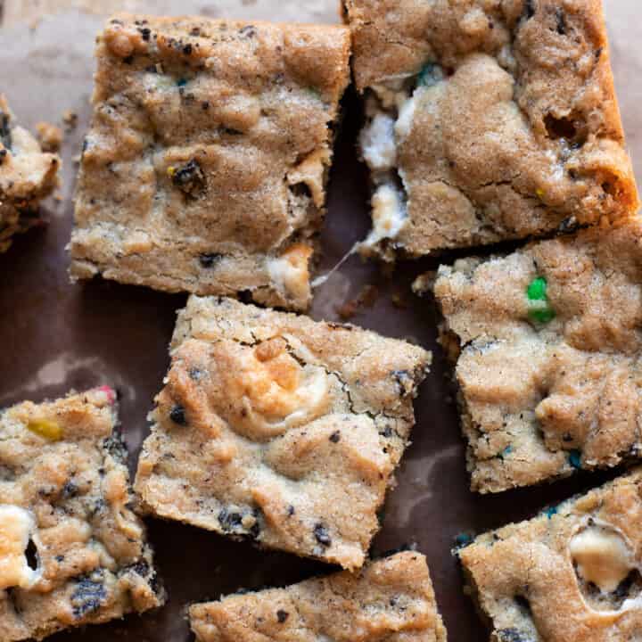Scrumptious cookie bars filled with marshmallows, oreos and mms