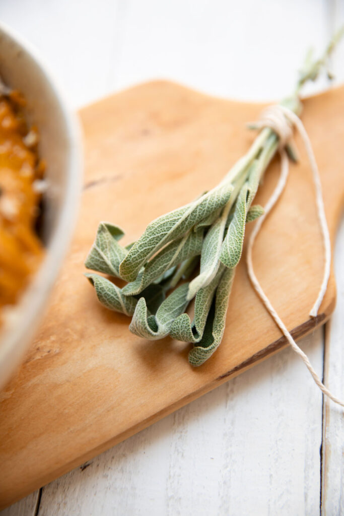 sage leaves on a cutting board