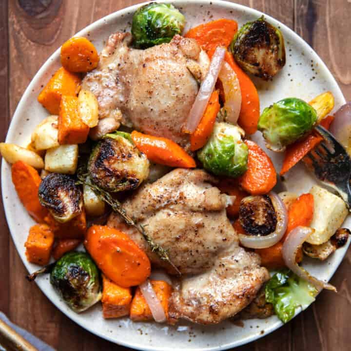 sheet pan with roasted chicken thighs and root vegetables