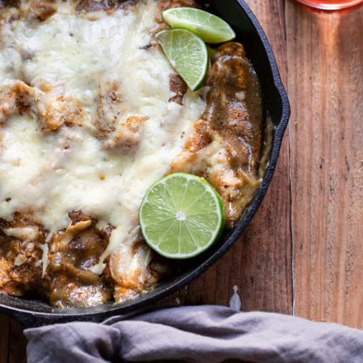 corn tortilla short rib enchiladas in a skillet