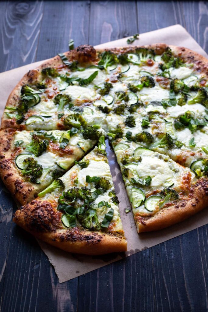 pizza with broccoli zucchini and pesto