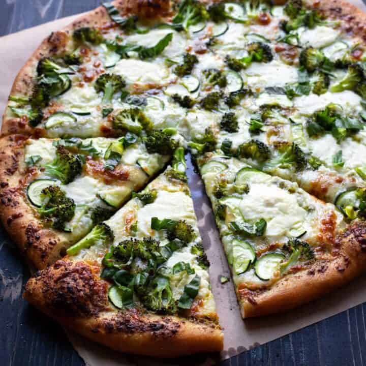 pizza with broccoli zucchini and pesto