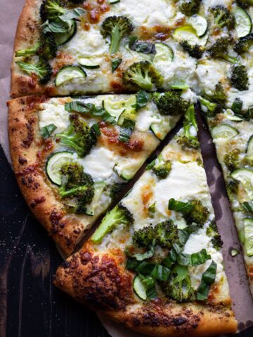 pizza with broccoli zucchini and pesto