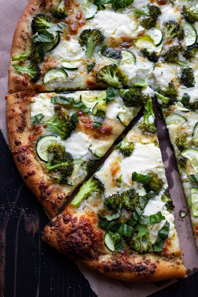 pizza with broccoli zucchini and pesto