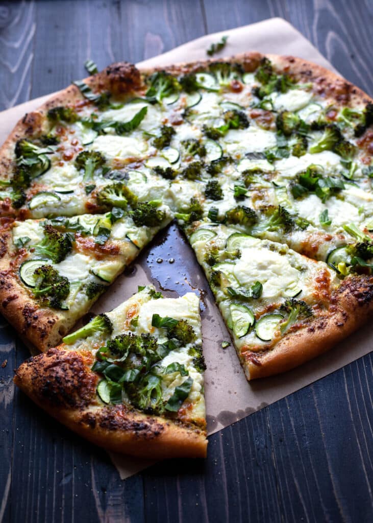 pizza with broccoli zucchini and pesto