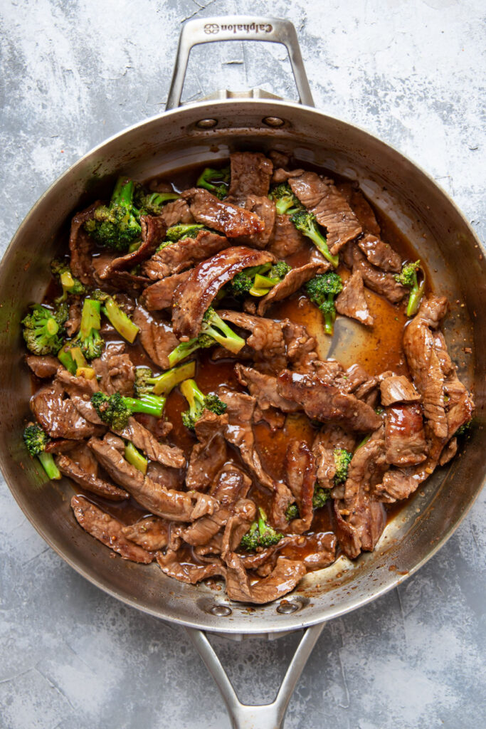 beef and broccoli in a saute pan