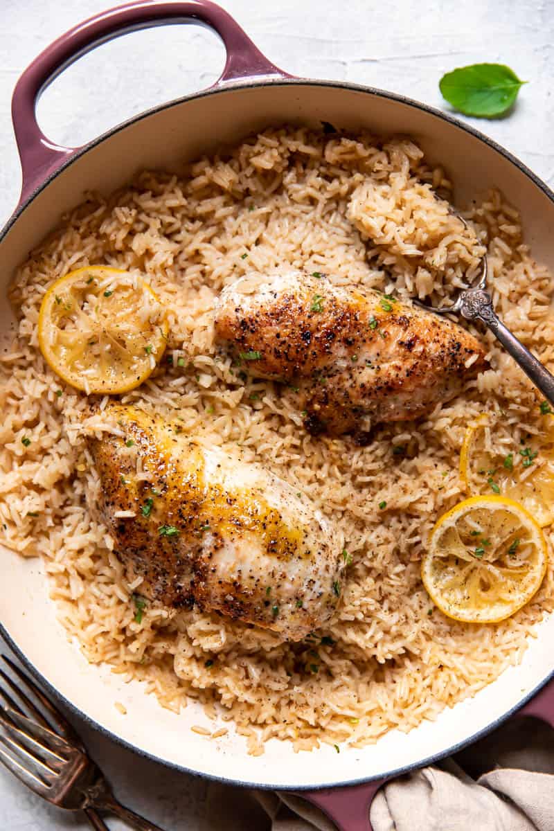 lemon chicken and rice in a pan.