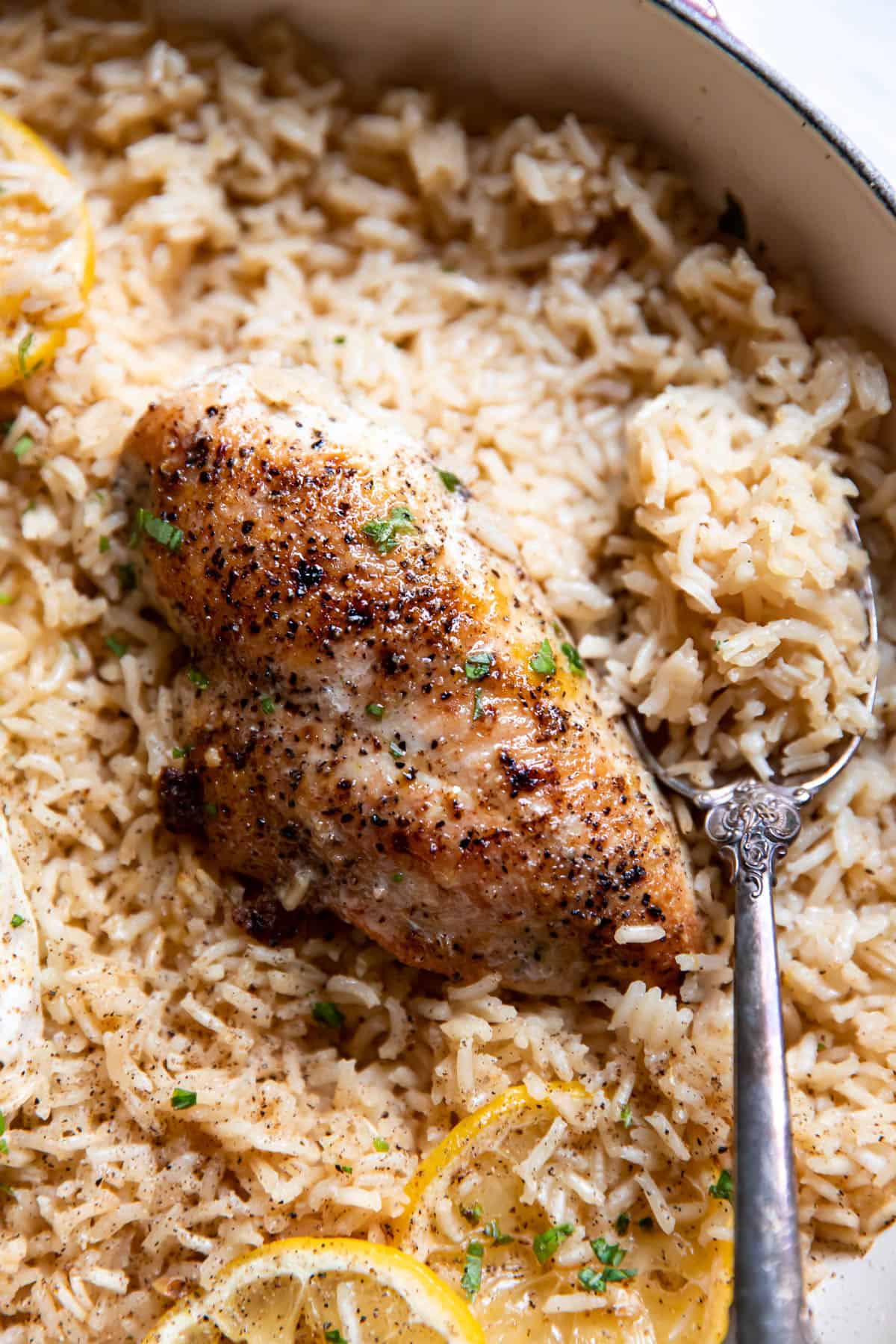 lemon chicken and rice in a pan.