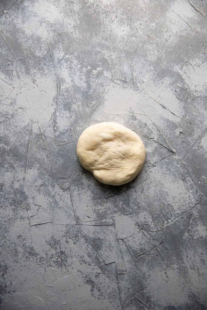 ball of pretzel dough on a flat surface